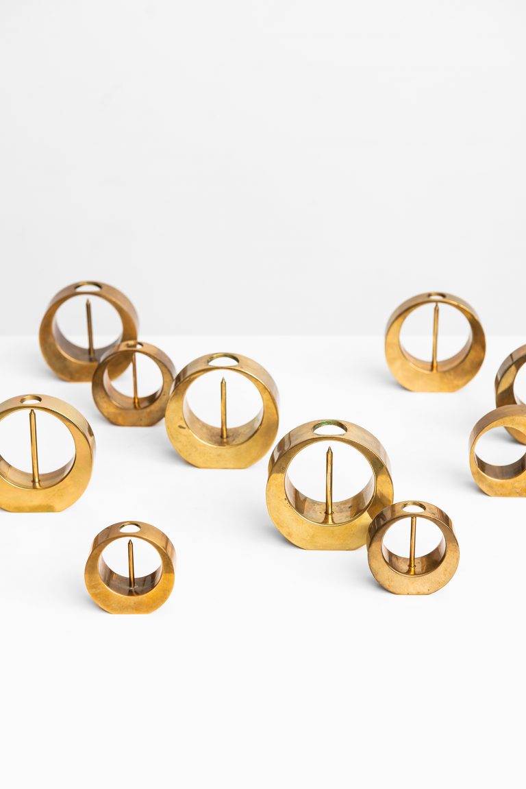 Arthur Pe set of 10 candlesticks in brass at Studio SchallingArthur Pe set of 10 candlesticks in brass at Studio Schalling