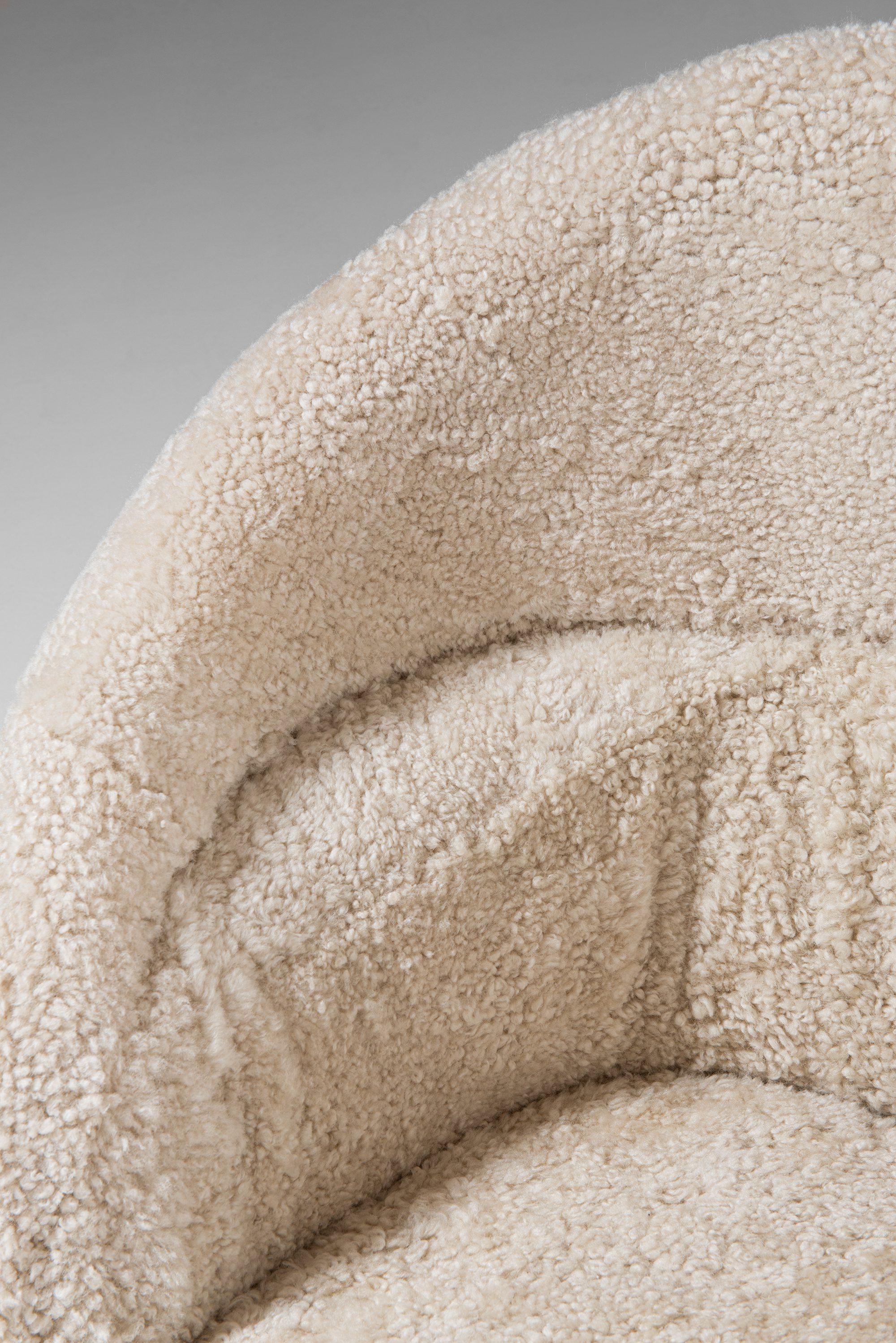 Arne Norell sofa in dark stained beech and sheepskin at Studio Schalling