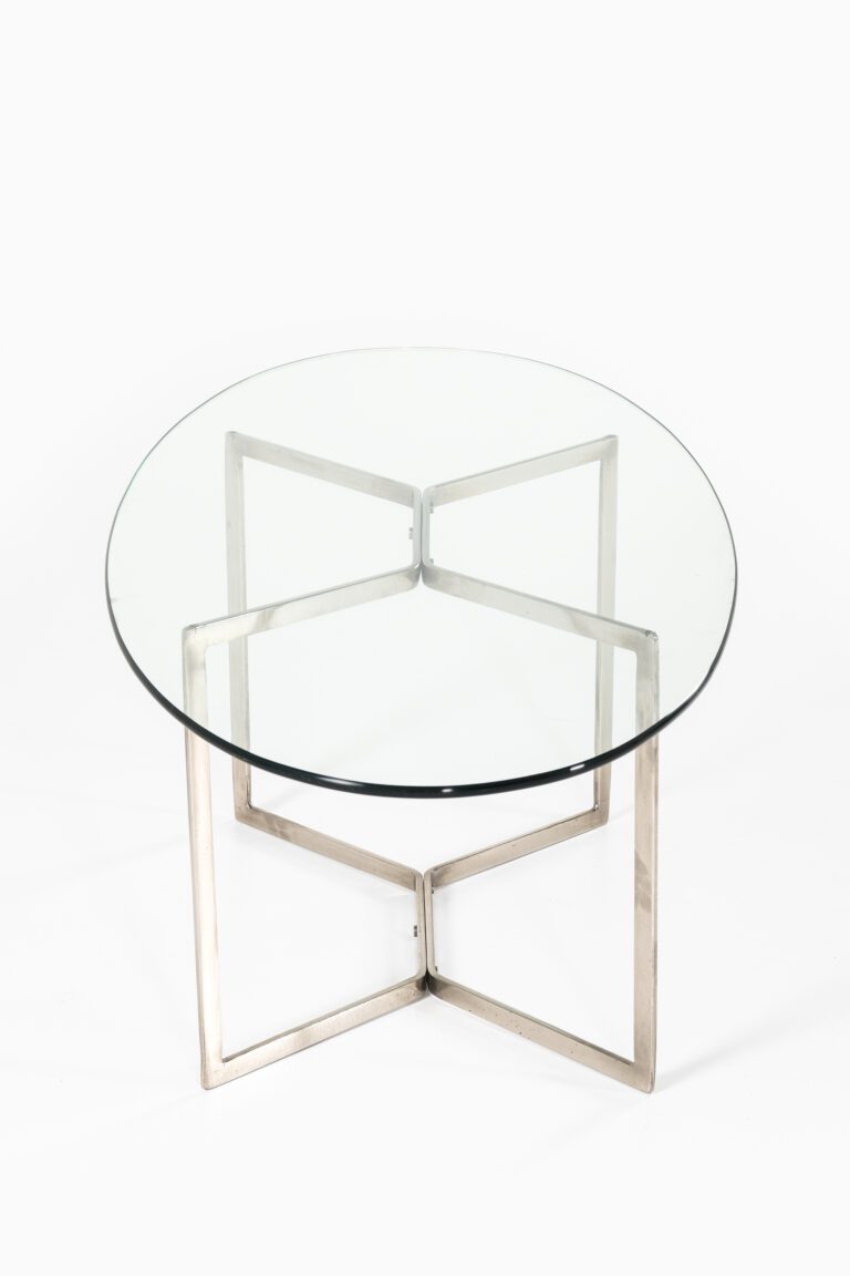 Glass coffee table with chrome base at Studio Schalling