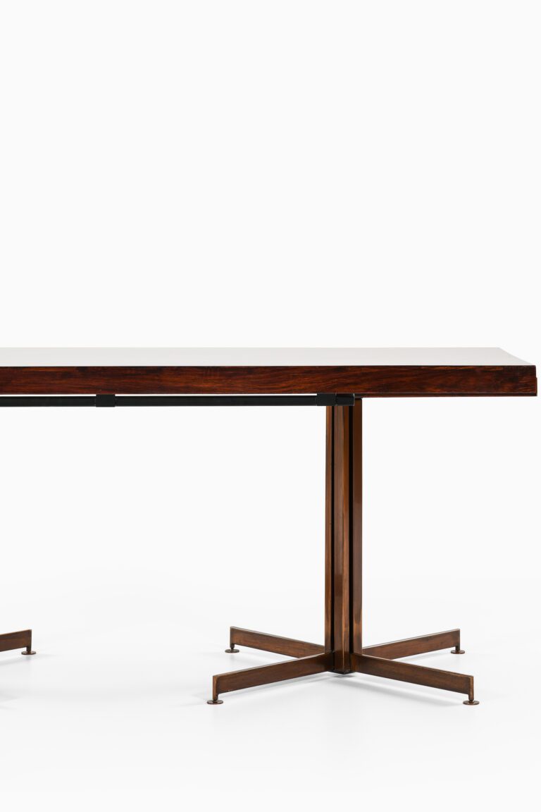 Dining table in bronze and mahogany at Studio Schalling