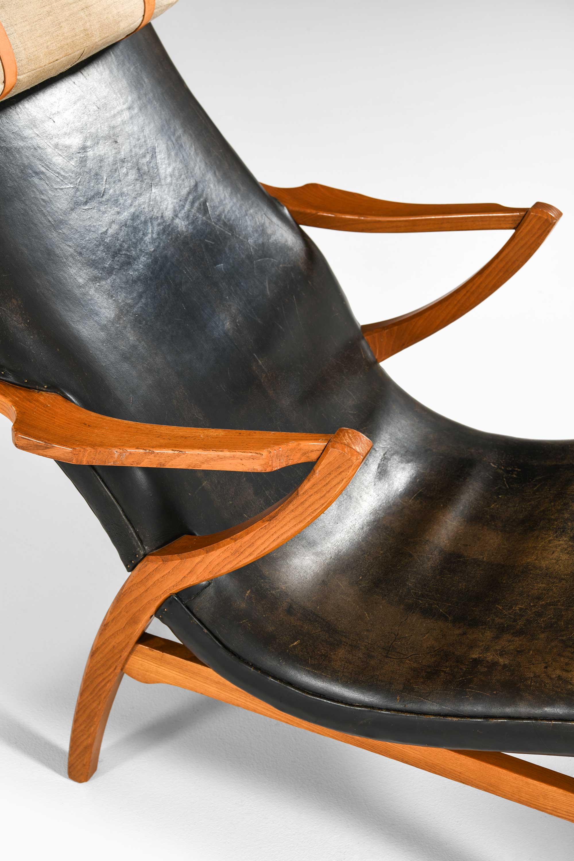Easy chair in elm and black leather at Studio Schalling