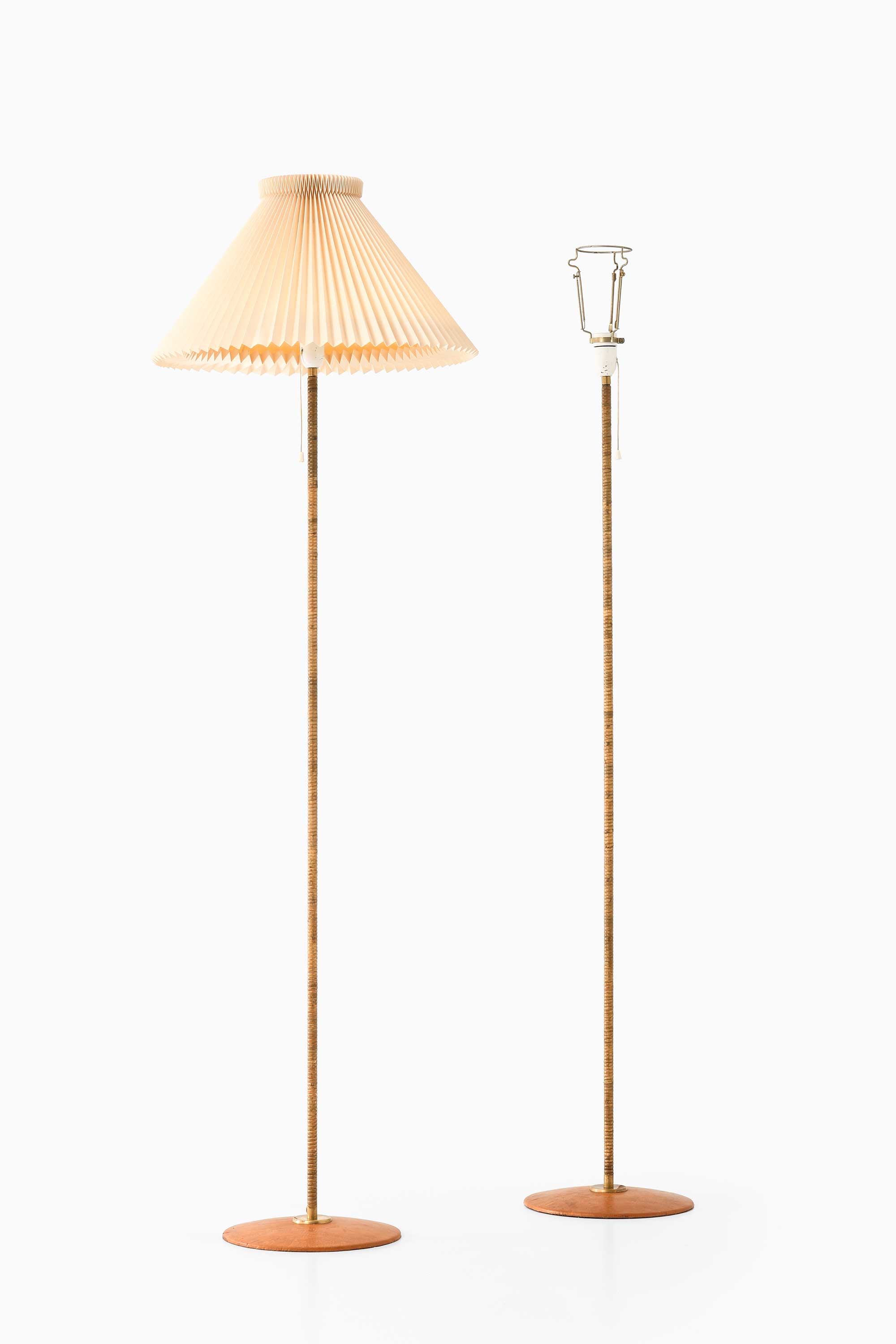 Floor lamps in leather and cane at Studio Schalling