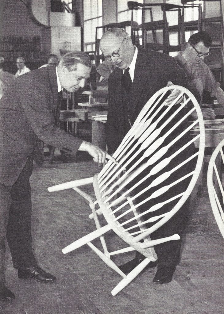 Hans J. Wegner and Johannes Hansen with the Peacock Chair, c. 1960